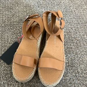 Size 7 women’s tan espadrilles either an ankle buckle